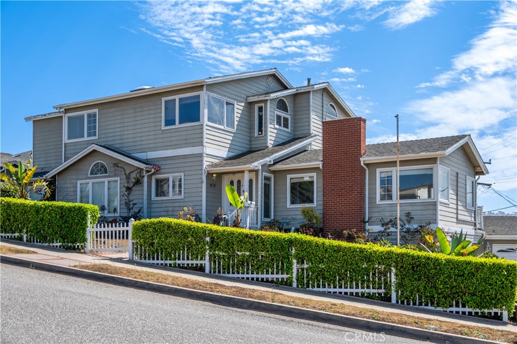 Opportunity of a lifetime! This property sits on one of the largest residential lots in South Redondo with amazing panoramic ocean and coastline views. The existing custom Cape Cod residence offers 6 bedrooms, 4 bathrooms. The home needs work and has tons of potential with vaulted wood-beam ceilings, oak hardwood floors, Anderson dual-pane windows, imported Brazilian granite, and spacious living areas filled with natural light. The home features a master suite with fireplace, Jacuzzi tub, and balcony, plus den, office, oversized heated garage/workshop, huge lot and once had a 800 sq. ft. detached guest quarters (sellers removed and have floor plans and drawings for a new 1,200 sq. ft. detached guest quarters—along with room for RV or boat parking.
The sale also includes permit-ready plans offering two paths forward:
1. Remodel the existing home and modernize it to today’s standards and add build ADU.
2. Ground-up new build: a 4,140 sq. ft. estate with 4 bedrooms, 4 bathrooms, office, gym, oversized 2-car garage, plus a separate 1,200 sq. ft. ADU with 2 bedrooms and 2 bathrooms.
There might also be a third option based on exploring the SB9 laws (urban lot split), buyers and buyers agents should look into and verify the possibility of doing a subdivision of the lot and build two new single family homes since the lot is so large.
Just blocks from the sand, Esplanade, and Riviera Village, this AAA location on the Avenues provides walkability to shops, dining, and top-rated schools. Whether you choose to update the existing home or pursue the approved new build, or if approved do an SB9 urban lot split and build two new homes. This amazing opportunity delivers scale, views, and opportunity rarely found in South Redondo.