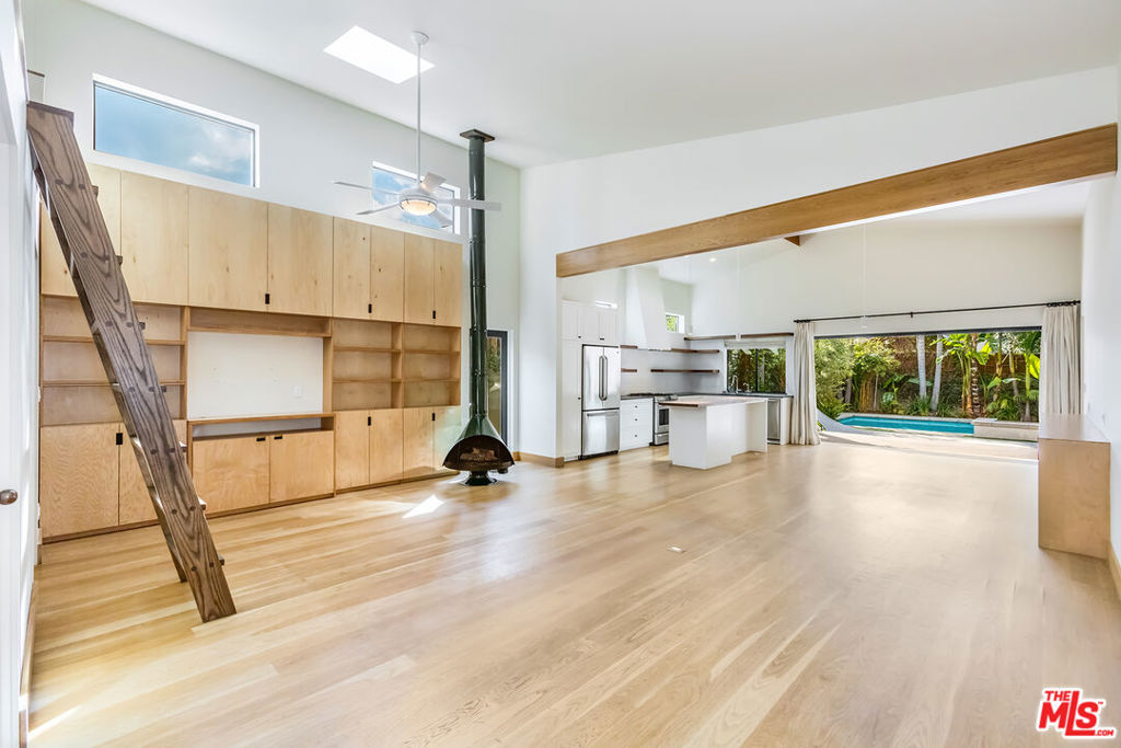 Newer Construction Contemporary 4 bedroom, 4 bath home with pool in Valley Village neighborhood of Studio City. Located just blocks from Ventura, this bright and open floor plan offers high ceilings, recessed lighting and hardwood floors throughout.Living room features built-in shelving, gas fireplace and skylights; adjacent to Dining area and Remodeled kitchen with breakfast counter island, stainless steel appliances and wall of glass that opens to spacious & private backyard with pool, spa and deck; perfect for indoor/outdoor entertaining. Other features include attached 2-car garage, laundry room, central air and heat, four security cameras linked to TV, doorbell with camera and grassy front yard with porch. Close distance to the trendy Tujunga Village and park, Aroma Cafe and many other shops and restaurants Studio City has to offer.