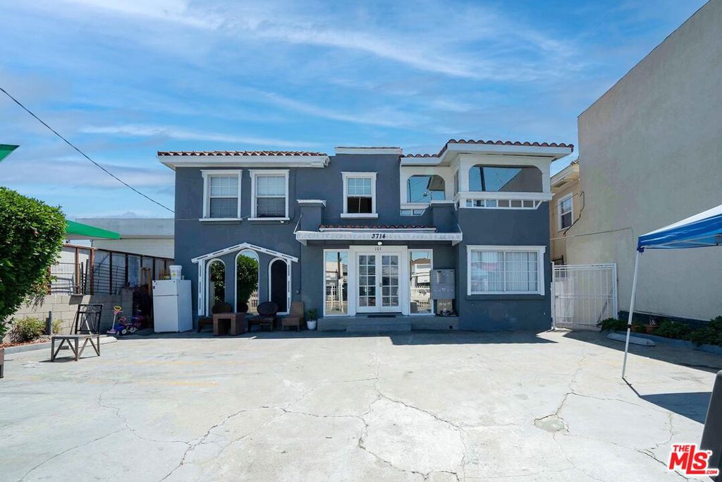 Compass is pleased to present the opportunity to acquire a mixed-use commercial income property in the Arlington Heights neighborhood of Los Angeles. This property boasts commercial zoning with a use code for boarding/rooming houses, apartment hotels, and hostels- offering incredible flexibility and income potential. The front building currently features 11 bedrooms and 6 bathrooms, in addition to 4 studios on the side and two 2-bedroom, 1-bathroom units in the rear. The second building features a duplex, each unit with 2 bedrooms and 1.5 bathrooms. In total, the property boasts 23 bedrooms and 11 bathrooms. With rents currently below market rates, there is tremendous potential for the right buyer to convert this into a cash cow through creative strategies by leveraging the unique use code and zoning.