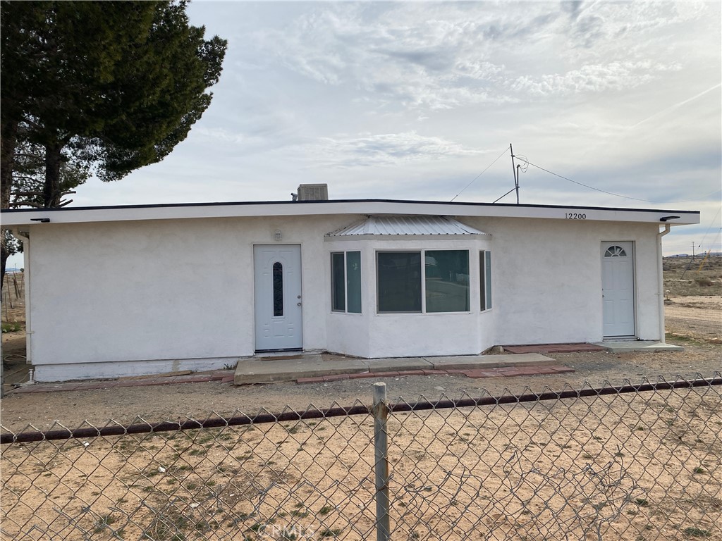 Spacious 3 bedroom 2 bathroom home situated on a large corner lot in Boron! This property offers open desert and Mountain View’s, providing plenty of privacy and a peaceful setting. One of the bedrooms features its own private area with a small kitchenette and full bathroom perfect for guests, extended family, or multi gen living. Convenient access to Highway 58 makes commuting easy while still enjoying a rural lifestyle. A great opportunity for buyers seeking space, flexibility, and desert charm.