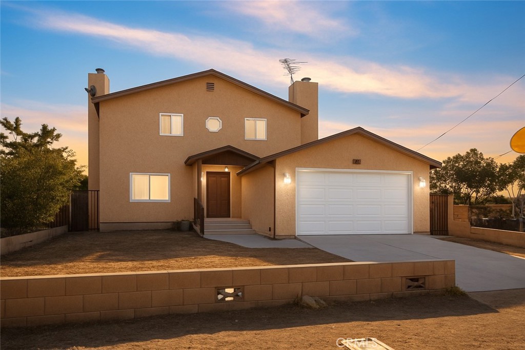 Experience the perfect blend of country charm and city convenience in this beautifully updated two-story home, just minutes from Palmdale Lake. Situated on a commuter-friendly lot with quick access to Hwy 14, this property is being sold with an additional 7,481 sf vacant lot directly behind it (APN: 3053-014-034), offering endless possibilities—whether you dream of expanding, adding more living space, or creating your own outdoor oasis.
From the moment you arrive, the inviting entryway sets the tone for the warmth and comfort that flows throughout. The home has been meticulously refreshed with fresh interior paint, new double-pane windows, new floors, a new water heater, and remodeled bathrooms. The spacious kitchen, complete with granite countertops and ample cabinetry, is perfect for preparing meals while staying connected to the home's inviting living spaces.
Both the living room and family room feature cozy fireplaces and sliding glass doors that lead to the patio, making indoor-outdoor entertaining effortless. Upstairs, the oversized primary suite boasts a walk-in closet, while two generously sized bedrooms offer flexibility for family, guests, or a home office. The double lot provides abundant room for storing your RV, boat, or recreational toys, and even the opportunity to build a workshop or guesthouse. With central air and heating, recessed lighting, and ceiling fans, this home ensures year-round comfort. Whether you’re looking for room to grow, a place to host unforgettable gatherings, or a property with investment potential, this move-in ready Palmdale gem is ready to make your vision a reality.