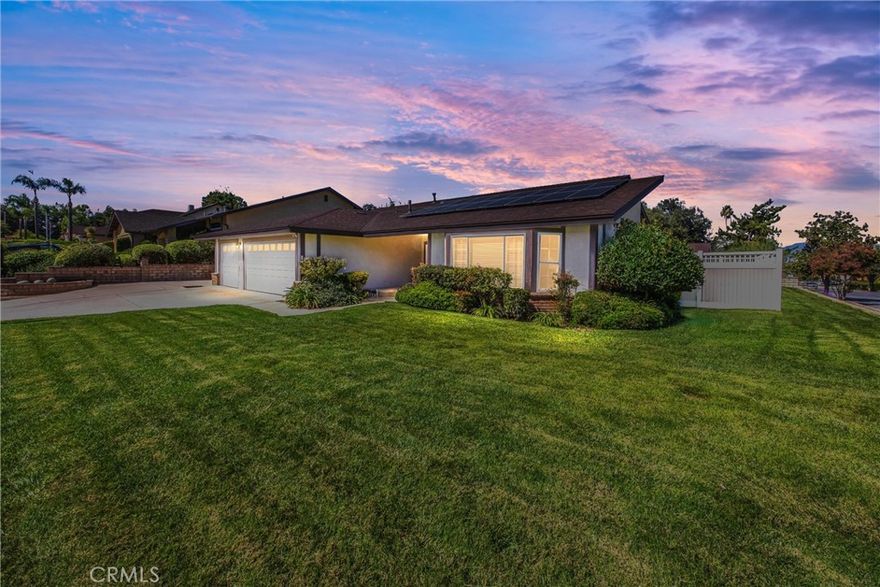 Well maintained single-story home in desirable South Redlands featuring 4 bedrooms, 2 bathrooms, and approximately 1,975 sq. ft. of living space on a spacious 10,948 sq. ft. lot. This move-in ready home offers new carpet throughout, wood and tile flooring in select areas, a well-designed floor plan with living room, family room with fireplace and galley kitchen with granite counter tops. Additional highlights include a three-car garage with an electric car charging station, fully paid solar panels, and potential RV parking at side of house. The large backyard features an aluminum patio cover with a hot tub, fruit trees, and plenty of space to entertain, garden, or relax. Conveniently located near Redlands Community Hospital, schools, parks, downtown Redlands, and freeway access.