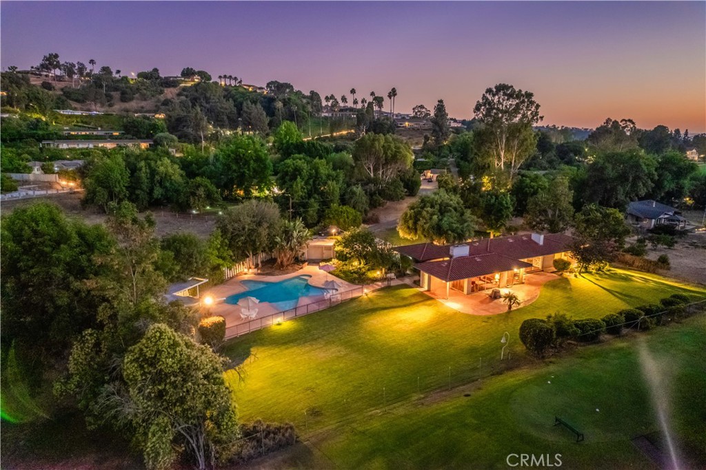 ONE OF A KIND!!! This amazing Property is located in a Cul-De-Sac on a 1.638 acres ALL FLAT LOT with endless possibilities. It has private long driveway and the backyard opens directly onto the golf course, offering unobstructed views of the lush fairways and serene landscape. It features 4 bedrooms, 2 bathrooms and 2 car attached garage. Very open floor plan with large windows and sliding doors that allows the natural light flows into the house. Large living room with fireplace. The bright family room is connected to the dining room, making it perfect for entertaining. The huge backyard features an oversized pool with a breathtaking views of the golf course and room for TENNIS COURT or ADU and much more. This property is ideally located next to South Hills golf course/country club and close to shopping centers and parks. Award winning school district. This property need of TLC, it is zoned for horses and maybe eligible for subdivision. Excellent opportunity to build your dream home! This location that cannot be duplicated, for the visionary, the collector, the one. Don't miss your chance to claim this exceptional property!