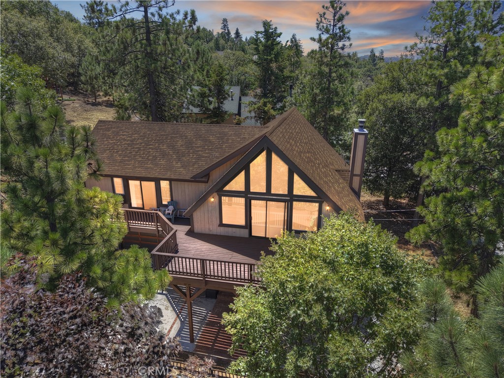 Discover your mountain retreat in the heart of Lake Arrowhead's coveted neighborhood, where everyday living feels like a permanent vacation. This charming 3-bedroom, 2.5-bathroom home spans 1,911 square feet of thoughtfully designed space that maximizes both comfort and natural light.
Enter to an impressive great room featuring soaring vaulted ceilings that create an instant sense of grandeur. The open floor plan seamlessly connects the living areas, while strategically placed skylights bathe the interior in warm, natural light throughout the day. The main level houses the kitchen, laundry, and a convenient half bath, while all bedrooms are tucked upstairs for privacy, including a primary suite with its own bathroom.
Lake rights come with this property, putting you in close proximity to pristine waters and recreational opportunities. The location couldn't be better – you're close to Tavern Bay Beach Club and Lake Arrowhead Elementary School, making this ideal for those seeking convenient access to amenities and recreational opportunities.
Outdoor enthusiasts will appreciate the generous decking that wraps around both front and rear of the home, perfect for morning coffee or evening gatherings. The two-car garage includes bonus storage space and accommodates boat parking – because what's a lake house without easy access to water toys?
The neighborhood puts you minutes from Lake Arrowhead Village's shopping and dining scene, plus family-friendly SkyPark at Santa's Village. For adults seeking relaxation, Lake Arrowhead Brewing Company offers craft beverages, while Sycamore Ranch Vineyard provides wine tasting experiences.
This isn't just a house; it's your gateway to the the Lake Arrowhead Lifestyle you've been dreaming about.