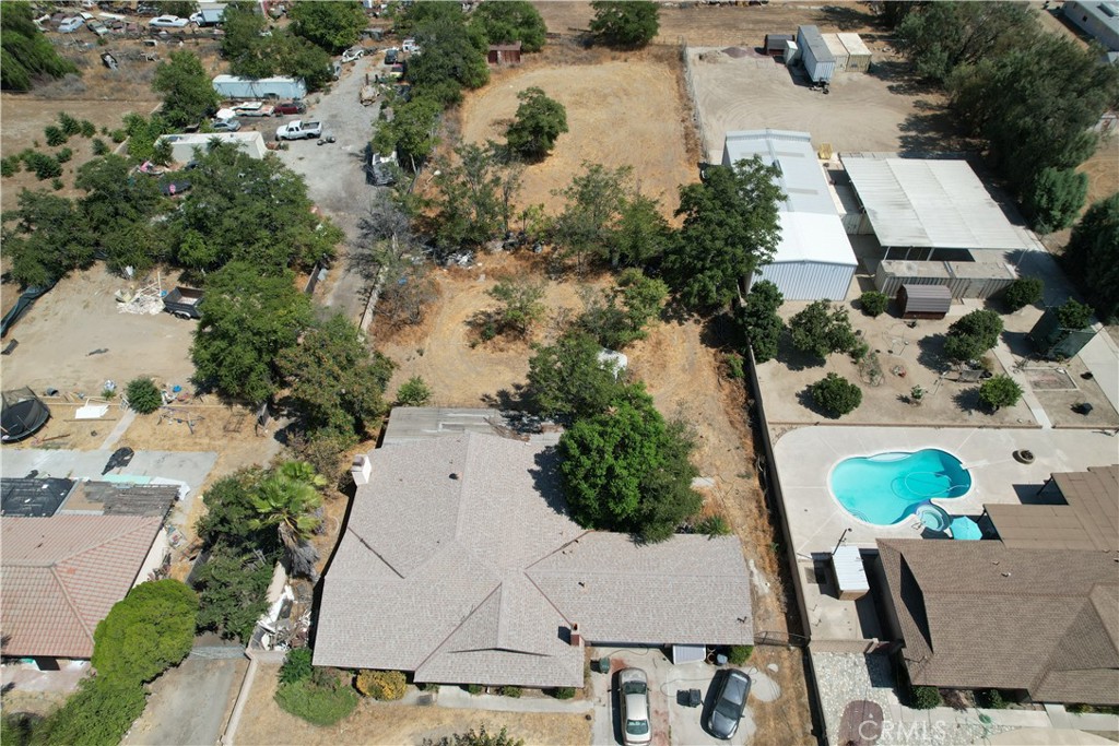 Welcome home to 9575 Locust in Fontana. This home boasts 38,500 square feet of all flat usable land! Plenty of room for toys, animals or a blank space to let your imagination run wild. Single story home with 3 bedrooms, 2 bathrooms and a 3-car garage! The main floor primary bedroom suite features a fireplace in the retreat and attached bathroom with large soaking tub and walk-in shower. There are two additional fireplaces in the living room and great room, perfect for cozy nights. The roof was replaced about 10 years ago. Located near shopping, dining, medical facilities, parks, schools, freeway access and more!