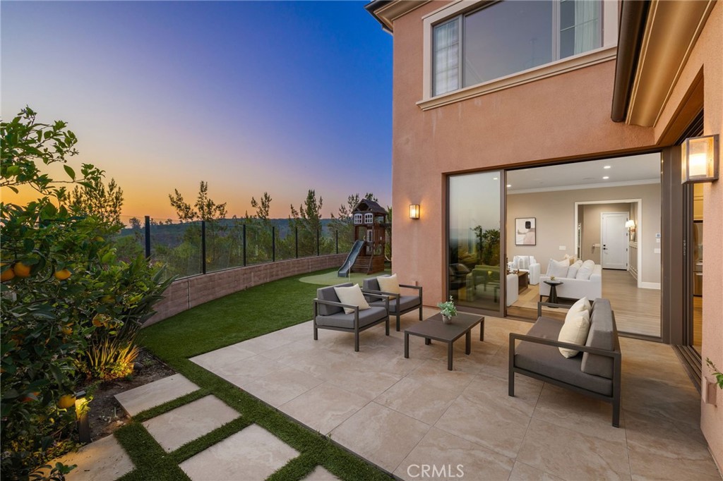Rare Premium Lot in Guard-Gated Reserve at Orchard Hills
Welcome to 168 Bellini, an exceptional Como Plan 2 home situated at the very end of a single-loaded street in the prestigious Reserve community of Orchard Hills. This premium lot offers unparalleled privacy with no neighbors on three sides and sweeping elevated city views of Irvine.
Designed for luxury and functionality, the residence features soaring ceilings and an open-concept layout. The main level is framed by three walls of floor-to-ceiling sliding glass doors, flooding the living spaces with natural light and maximizing indoor-outdoor living. A first-floor bedroom with a full en-suite bath provides convenience and flexibility. Upstairs, you’ll find three additional en-suite bedrooms and a spacious loft perfect for a home office, playroom, or media area.
Enjoy outdoor living in the expansive backyard, complete with a custom playground set. Located within a 24-hour guard-gated enclave, residents enjoy resort-style amenities including two clubhouse pools, scenic trails, and lush avocado groves. Zoned for award-winning Northwood High School.
This is a rare opportunity to lease one of the best lots in Orchard Hills Reserve - private, elevated, and beautifully appointed.