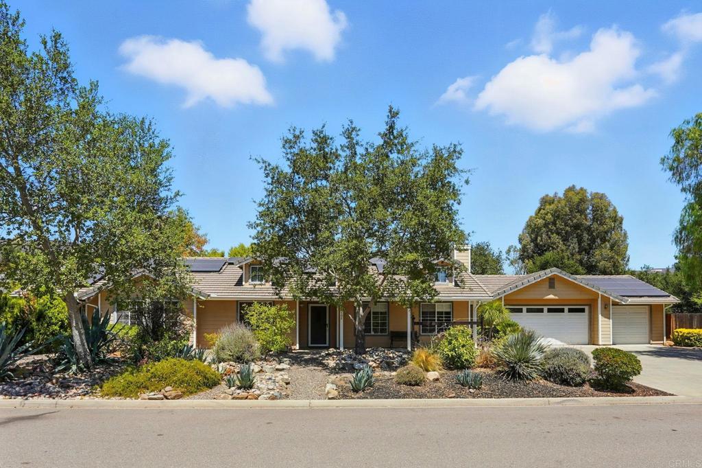 Spacious single story in San Diego Country Estates. This 4BR/2BA, 2,124 sq. ft. home sits on a corner lot of nearly half an acre and features an open concept layout with seamless flow between kitchen, dining, and living areas. Highlights include paid solar, 3 car garage, RV parking, and low maintenance landscaping. Enjoy the SDCE lifestyle with HOA amenities including walking trails, two pools, hot tub, pickleball and tennis courts. A perfect blend of comfort, function, and community, move in ready.