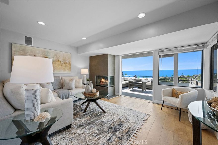 This three-bedroom, three-bath Laguna Beach home located in Arch Beach Heights, enjoys sweeping ocean views from the living room, entry, kitchen, and 2 upper-level decks. The panoramic views stretch from Catalina Island up the coastline to Palos Verdes, with year-round sunsets that light up the sky. Just one block away is Moulton Meadows Park, a large city park with tennis courts and children's playground with access to Laguna’s extensive trail system, offering wide-open views and miles of hiking. The property itself includes a large driveway and a full two-car garage with cabinets, countertop workspace, a closet, and a Tesla wall charging unit. A fully fenced backyard with a lemon tree provides private outdoor space. Additional features include a wine room, remodeled kitchen and bathrooms, customized closets, new electrical panel, new PEX plumbing, whole-house water filtration, resurfaced decks and exterior, newer roof, and fresh interior and exterior paint.
