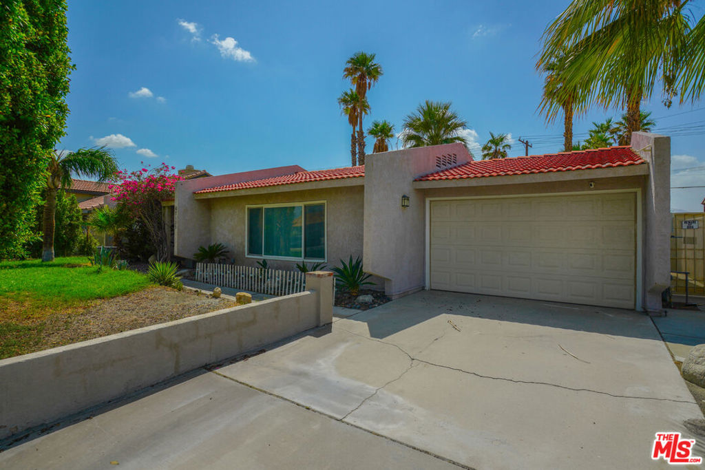 A stylish and private desert retreat that combines comfort, flexibility, and incredible potential. Nestled on owned land (NOT leased) with NO HOA, this property gives you the freedom to live as-is or transform it into your ultimate desert dream home, just minutes from Palm Springs dining, shopping, and world-class attractions. Inside, enjoy a functional, livable layout filled with natural light, sleek finishes, and panoramic mountain views. The home is powered by solar, making it energy-efficient and cost-friendly. Step outside to your private spa with upgraded plumbing, cozy fire pit, and lush mature trees, rare oasis in the desert. The massive lot offers ample space to add a pool, outdoor kitchen, or even an ADU. Whether you're looking for a move-in ready home or the perfect canvas to reimagine, this property offers endless possibilities.