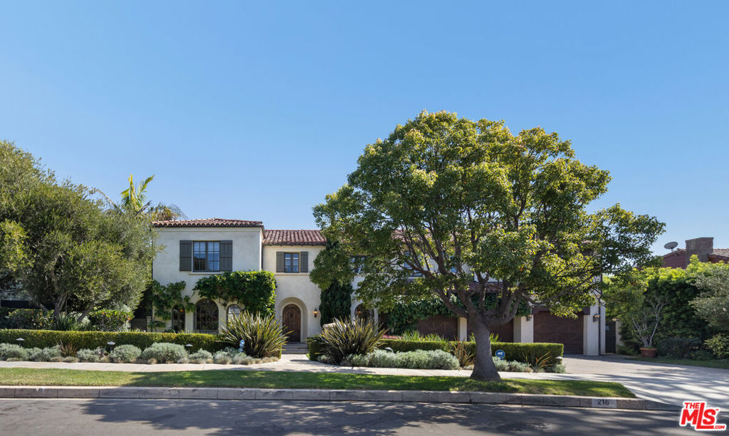 Located in the highly sought-after Huntington Palisades, this timeless Spanish-inspired estate reflects infinite charm and significant quality. Originally custom-built and thoughtfully designed, this quintessential family home features five bedrooms, six bathrooms and an oversized three-car garage. Step inside to discover inviting interiors featuring a formal dining room and formal living room with fireplace, connecting to a private office with French doors leading out to a tranquil garden. The family room with fireplace showcases captivating windows that provide an abundance of sunlight. The continuous flow leads to the kitchen and breakfast area, opening to an expansive landscaped yard with canyon, mountain, and partial ocean views. This outdoor oasis features a pergola with an outdoor fireplace, seating area, BBQ, pool, and spa. Upstairs, the primary bedroom with fireplace boasts ample natural light, a glimpse of ocean views and an en-suite sitting area or office leading out to a picturesque balcony, followed by a large en-suite bathroom with dual closets. An upstairs family area with a balcony overlooking the front yard connects the other three bedrooms with en-suite baths. This perfect family home is an opportunity not to be missed, within close distance to the beach and the most desirable restaurants and shops.