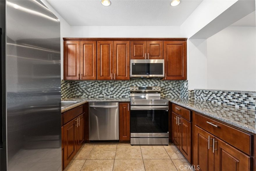 SINGLE LEVEL 2 BEDROOM, 2 BATHROOM CONDO WITH SUNSET & PEEK A BOO OCEAN VIEWS IN BEACON HILL. Upgraded kitchen with granite counters and tile backsplash. Large, spacious living room with fireplace and slider to patio with canyon views. Primary bedroom opens to private patio and has a bathroom with shower separate from the vanity area.  Hardwood flooring & wood burning fireplace. Short drive or ebike to the beach, downtown Dana Point, Monarch Beach Club, Blue Ribbon schools and 10 minutes to Laguna Beach. HOA amenities include 3 pools, including a lap pool, 6 lighted tennis courts, and the surrounding parks. One covered parking spot with multiple parking spots within the community for guests or a second car. Washer, dryer, and refrigerator included. Rent also includes water and trash.