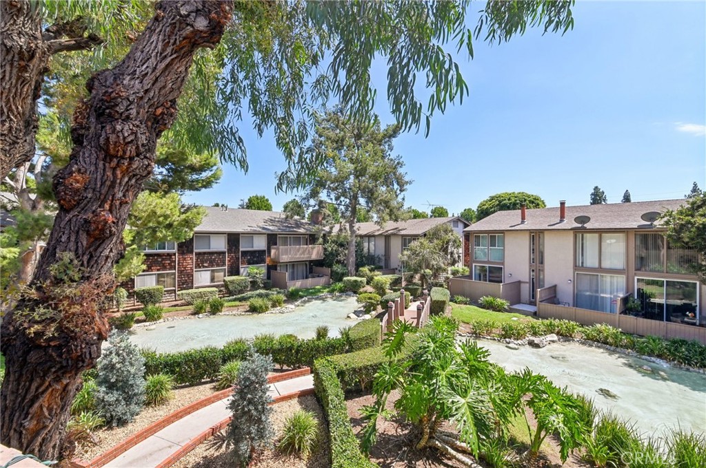 This 2nd story, end unit 2 bedroom, 1 bath condo is located in the beautiful "The Redwoods" condominium complex on the Tustin border. The unit has an amazing view of the pond and mature trees giving you that cozy fall feel! And... you are actually zoned for Tustin unified school district. (TUSD) receives strong rankings, with Niche.com placing it among the best districts in California, often within the top 500 nationally for overall quality and for diversity. You're less than 5 minutes to the 5 and 55 freeways, so it's perfect if you have to do any commuting, and you're less than 15 minutes to The Market Place, Main Place Mall, South Coast Plaza, and John Wayne Airport. The community comes with access to 2 pools, a spa, tennis courts, gym, clubhouse, and more. And, they cover water, gas, trash, and sewer. Not to mention, it's FHA and VA approved! So... a great price, location, schooling, and accessibility, what do you think, is this your new home?