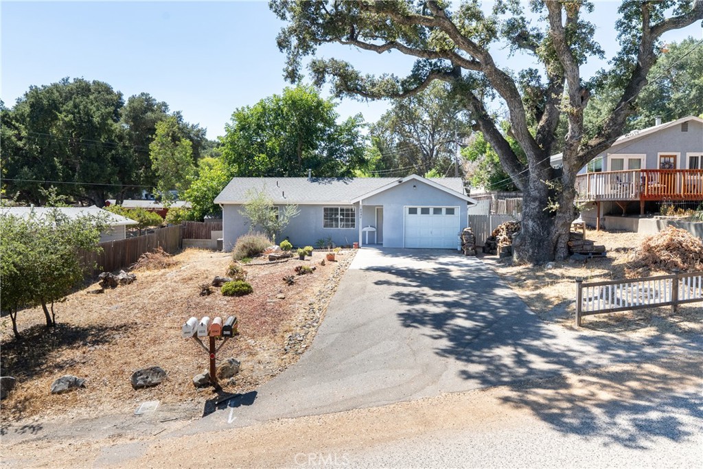 Charming and hard-to-find 1-bedroom, 1-bath home with a single garage on approximately .15 acres. A beautiful oak tree greets you as you drive up, setting the tone for this inviting property. The open floor plan flows seamlessly to the dining area, where sliding doors lead to a spacious backyard featuring a concrete patio and covered seating area—perfect for entertaining or gardening. The front yard offers plenty of space for RV or additional parking. The bedroom boasts a large walk-in closet, and there’s plenty of potential to expand or build a larger home in the future. Whether you’re looking for an affordable starter home or a smart investment, this property offers flexibility and charm in one package.