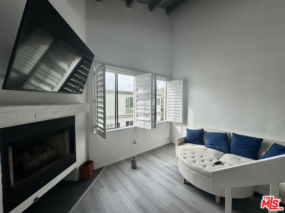 Located just steps from the sand on the Marina del Rey Peninsula, this recently updated multi-level unit offers the perfect blend of comfort and coastal charm. The 1 bedroom + loft/office, 1 bath layout includes a spacious living area with a cozy fireplace and a private balcony overlooking the peaceful lagoon. The bright and airy interior features tasteful modern updates, an open kitchen, and abundant natural light throughout. The versatile loft space is ideal for a home office or guest area. Additional perks include community laundry, a one-car garage for $150/ month ,and close proximity to the beach, local cafes, and neighborhood shops. This is an ideal retreat for those looking to enjoy the best of beachside living.