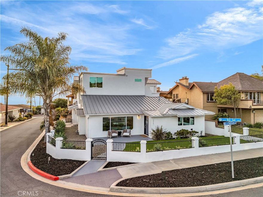 Modern Coastal Luxury in Coveted Capistrano Beach! Just down the street from the picturesque Pines Park and moments from Dana Point’s pristine shoreline, this never before occupied, five-bedroom, three-and-a-half-bath residence defines modern coastal sophistication and quality craftsmanship.
A striking Santa Barbara smooth stucco exterior and brand-new stainless-steel roof set the tone for the refined elegance within. Step inside to discover stunning white oak flooring that flows seamlessly throughout, complementing quartz countertops and all-Viking appliances, including an oversized refrigerator and freezer and a built-in wine cooler. Every element has been thoughtfully designed, with new PEX plumbing, completely upgraded electrical, and meticulous attention to detail throughout. The main level offers open-concept living and dining areas that open to a private deck—perfect for entertaining or enjoying ocean breezes. Upstairs, the primary suite features a cozy fireplace, oversized walk-in closet, private balcony, and breathtaking ocean views. At the top, a rooftop deck showcases panoramic Pacific vistas, ideal for sunset gatherings or quiet reflection. Additional highlights include a finished garage with epoxy flooring, adding a touch of polish and practicality to this remarkable coastal home. Every inch of this residence reflects modern design, enduring quality, and the relaxed elegance of Capistrano Beach living.