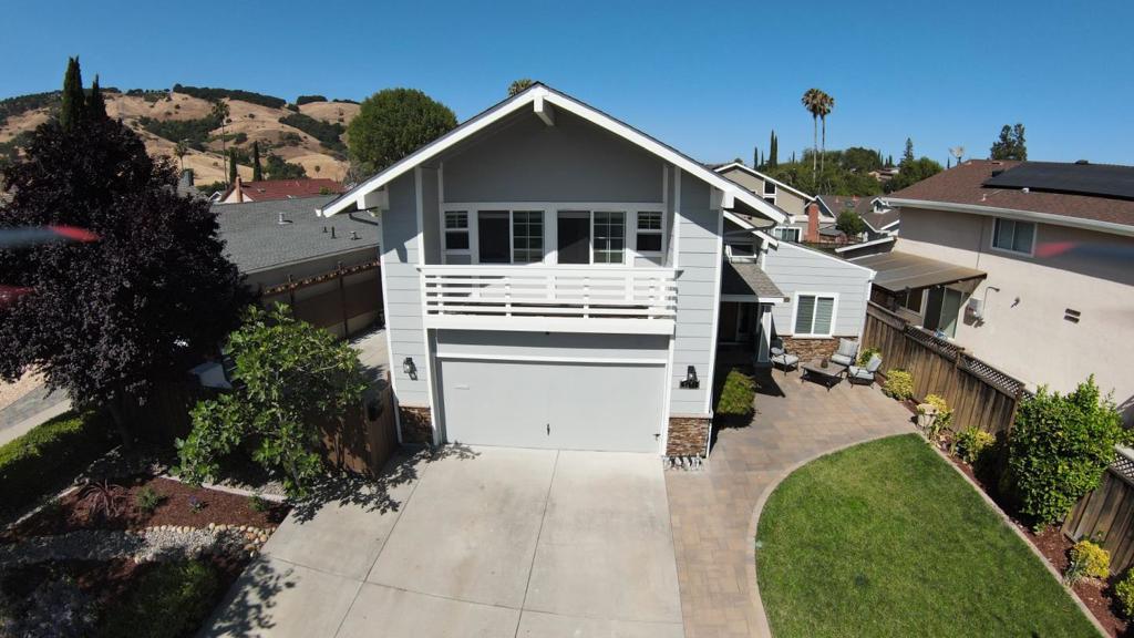 Walk into this home with its majestic high tray ceiling, modern chandeliers, and acacia wood flooring. This home is ready for you to move in and start making memories! Sellers raised three kids, and now they're all in college; it's time to downsize. The kitchen has been completely remodeled with custom cabinets, stainless steel appliances, quartz countertops, and a large walk-in pantry under the stairs. The backyard was designed for entertaining with a built-in gas grill, a gas fire pit, a well-lit pergola, and beautiful views of the Santa Teresa hills. The primary ensuite offers a recently remodeled bathroom and expansive windows. The living room is great for family night or a cozy day relaxing and reading a book. This house has undergone upgrades over the years, and you will enjoy every detail it has to offer.