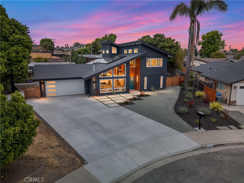 Stylish mid-century modern home located in the heart of Arroyo Grande on a quiet cul-de-sac. This spacious 4-bedroom layout includes three private suites, offering flexible living options for guests or multigenerational households. The home features engineered hardwood floors throughout, custom millwork, and a bright kitchen with a center island. Energy-efficient upgrades include owned solar with no true-up, a new roof, dual-pane windows, and fresh interior/exterior paint. Sitting on a quarter-acre lot, the outdoor space is a dream—complete with 8 fruit trees, raised garden beds, and room to entertain or expand. Peaceful yet conveniently located near shopping, dining, parks, and top-rated schools. A rare opportunity to own a thoughtfully updated home with character, charm, and modern efficiency in a prime Central Coast location.