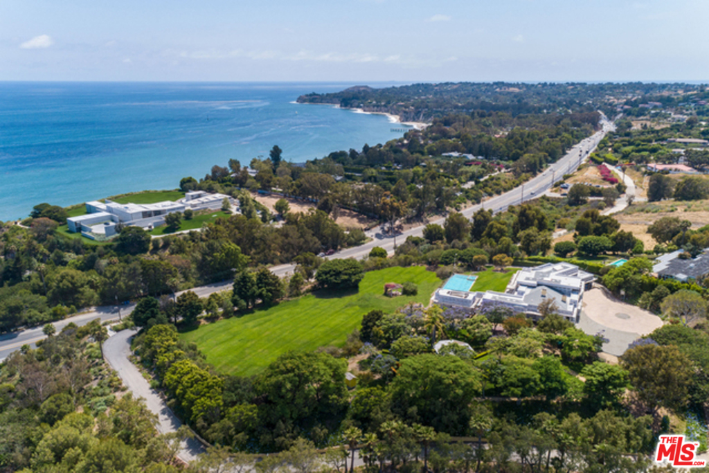 Endless opportunities for this approximately 7 acre ocean view compound that is spread across three parcels on Pacific Coast Highway. Approximately 11,000 square foot estate currently under construction with active plans, permits, and Coastal Commission approval already in place. Purchase and complete with style and finishes of your choosing or create your own dream compound. Private and gated entrance with driveway that circles the entire property.