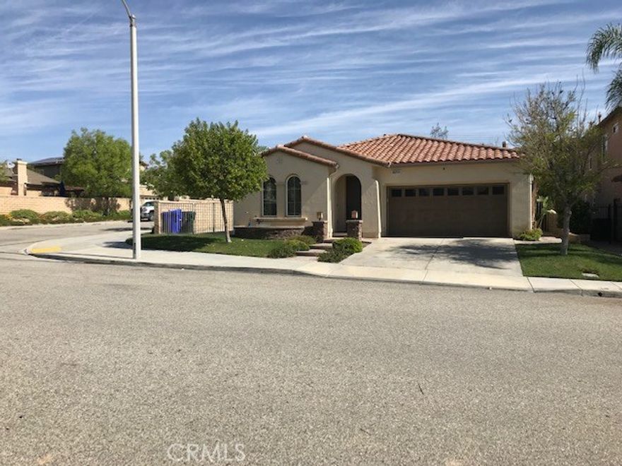 RARE ONE STORY. Spacious 3 bdrm home with 2.5 bathrooms. Tiled entry welcomes you. Grand living room. Large dining area. Endless cabinets and storage in the kitchen! Granite counters. There is great tile floor in the kitchen, bathrooms and traffic areas. Nice carpet. Stainless steel appliances. Double self-cleaning ovens, built in microwave, dishwasher. Center island! Open to the family room with fireplace. Just outside the family room is a patio across the entire width of the house. Grassy yard & automatic sprinklers, water fall. Laundry room for full size washer & dryer. Direct garage access from laundry room. The master suite Jacuzzi tub & separate shower,dual sink vanity,marble counter, generously sized walk-in closet. Other bedrooms with ample closet space. Hall bath with double sink vanity. Powder room with pedestal sink. Corner lot at the end of the street. One of the best location in neighborhood. Great elementary school is in walking distance !