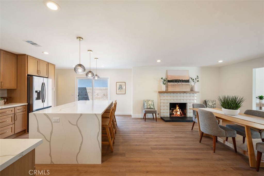 Fully remodeled, income-generating powerhouse in the highly coveted Westmont neighborhood of Fountain Valley! Sitting on a massive 7,200 sq. ft. lot, this 5-bedroom, 3-bath stunner is already configured as a 2-unit property and primed for huge returns — live in one, rent the other, or add an ADU to create a triplex and unlock serious cash flow. This Home is a Fountain Valley ShowStopper, designed for style, space, Multi-Generational Living and everything in between! Upstairs, the sprawling primary suite offers a private retreat with a custom bathroom, large walk in shower, and dual vanities. Downstairs, four large bedrooms include an en suite perfect for in-laws or a guest quarters. The open-concept floor plan is loaded with upgrades: brand-new designer kitchen with quartz counters, oversized island, self-closing cabinets, and new stainless steel appliances; spacious living room; luxury vinyl flooring; custom bathrooms; dual-pane windows; central AC; and fresh landscaping. For anyone wanting the rare blend of luxury, location, and income potential in one property — this is the Fountain Valley opportunity you’ve been waiting for! Close to Freeways, and situated in the Top Rated Fountain Valley School District, this is the ONE you've been waiting for!