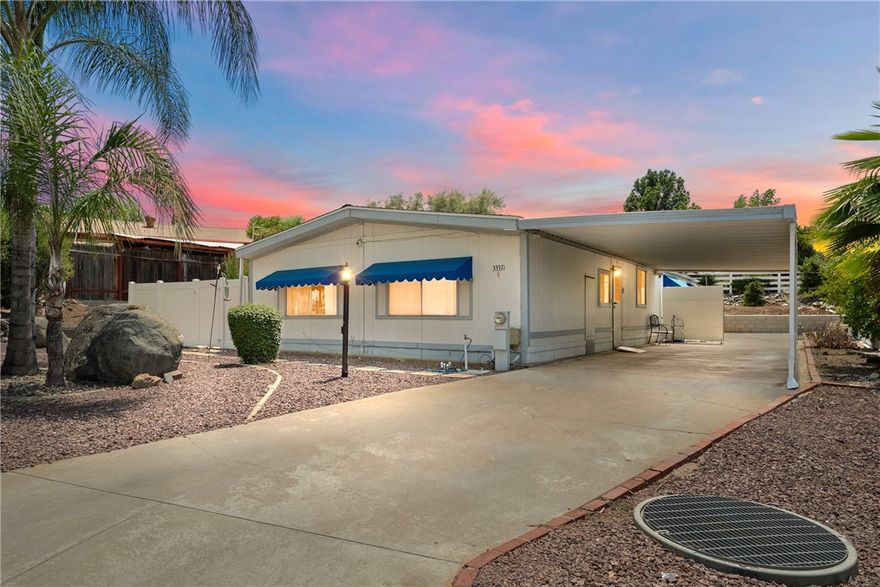 PRICE IMPROVEMENT! LIVE THE DREAM in one of Wildomar’s Most Coveted Community! Welcome to THE FARM, one of Wildomar’s most desirable neighborhoods—family-friendly, amenity-rich, and ideally located between the 15 and 215 freeways for easy commuting. Residents enjoy an impressive lineup of amenities, including three pools and spas, a clubhouse, basketball and tennis courts, a dog park, community gardens, scenic hiking trails, fishing ponds, and even RV storage—all for a low monthly HOA fee. This upgraded 3-bedroom, 2-bath home sits on owned land with a permanent foundation, offering long-term value, comfort, and peace of mind. Inside, you’ll love the highly functional layout: the private primary suite is thoughtfully separated from the guest bedrooms and expansive great room, perfect for families or shared living. Recent updates include a new roof, a reinforced and leveled foundation, luxury vinyl plank flooring in the main areas, and plush carpet with upgraded padding in the bedrooms and living room. The kitchen features modern appliances, and a generously sized laundry room makes everyday living easier. Outside, enjoy a newly installed PVC gated yard—ideal for pets, entertaining, or simply relaxing while taking in the mountain views. A large 10×24 workshop/shed adds extra utility, and the covered carport easily fits two vehicles. Yes this home is on a 433 and qualifies for FHA financing.

Whether you’re a first-time buyer, downsizing, or investing, this move-in-ready gem delivers the perfect blend of privacy, practicality, and lifestyle. Don’t miss your chance to be part of The Farm—where community meets comfort.