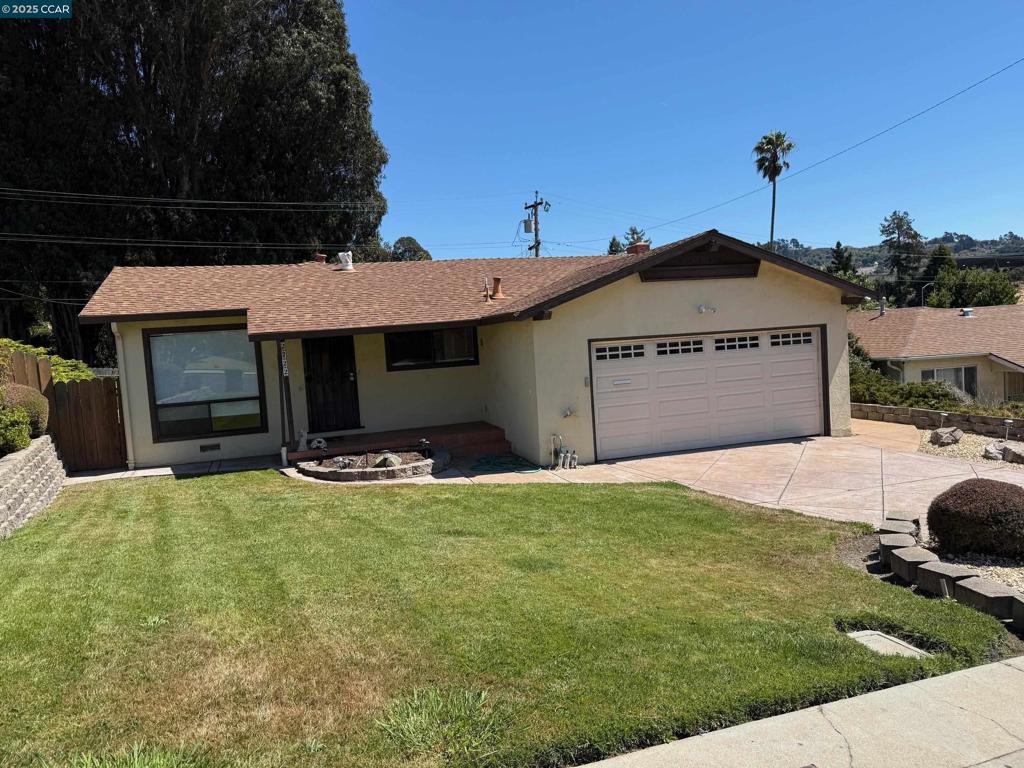 Come check out this attractively updated 3 bedroom, 2 bath centrally located home. The first thing you'll notice is the beautifully landscaped front yard with stamped and colored concrete driveway and walkway. Inside you'll love the laminate flooring throughout plus the nicely renovated kitchen. You will welcome the central heat and air conditioning for comfort during the changing seasons. Spend time with the family in the spacious family room or entertain in the covered backyard patio. You'll appreciate the convivence of the attached two car garage with interior access and the contemporary walk in tub in the front bathroom. You don't want to miss this one!