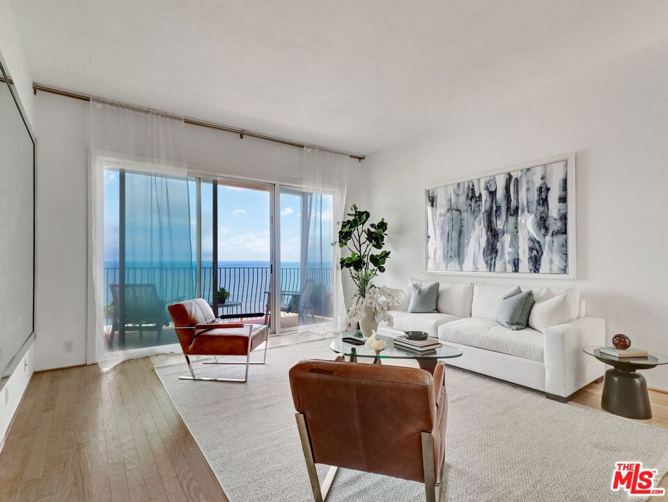 Welcome to your dream coastal retreat where location, views, and quality are truly unmatched. This recently updated upper-level 2-bedroom, 2-bathroom condo is your private oasis in Sunset Mesa, showcasing panoramic ocean views from nearly every room. The elevated dining area and kitchen are thoughtfully designed to capture breathtaking ocean views, as you cook and dine, sleek white cabinetry, quartz countertops, glass-and-stainless-steel railings, and engineered wood floors. Waking up here will feel like you're still in a dream. Soaring ceilings and floor-to-ceiling windows with sliding glass doors flood the space with natural light and open to a private ocean-view patio perfect for morning coffee or evening sunsets. Two beautifully tiled marble bathrooms and an in-unit laundry room offer modern convenience, while your vehicles and gear are securely stored in a private two-car garage with generous storage. Located in a boutique four-unit complex, the super-low HOA dues cover water, sewer, trash, insurance, including earthquake, and common-area landscaping. Just minutes from the iconic Getty Villa and the Palisades Village's shops and dining and only steps to the beach for surfing, biking, running, or simply strolling along the shore this is a rare opportunity to enjoy luxury, convenience, and coastal charm in one perfect getaway. Don't miss this rare opportunity to own a turnkey luxury condo in one of California's most coveted coastal communities.