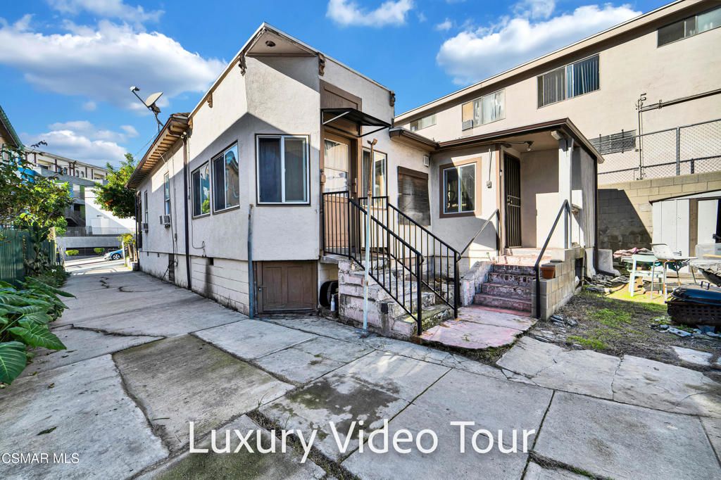 Photo of 638 N Bunker Hill Avenue, Los Angeles, CA 90012 (MLS # 226000109)