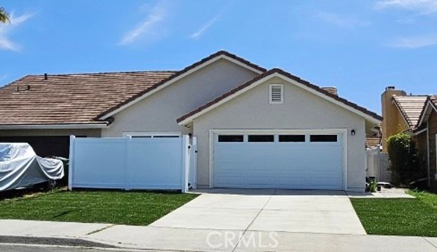 Fully Renovated Turnkey Gem in Oceanside! Step inside and experience the perfect blend of coastal tranquility and contemporary style in this beautifully remodeled move-in-ready home. Every detail has been thoughtfully upgraded, offering comfort, elegance, and peace of mind. Enjoy a brand-new kitchen and bathrooms featuring classic shaker cabinets, striking black faucets and hardware, sleek quartz countertops, modern tilework, and stylish new shower doors and tub. The home is enhanced by wide-plank luxury vinyl flooring, vaulted ceilings, and a rebuilt fireplace with chic new stone surround and updated doors—perfect for cozy evenings. Upgrades continue throughout with new windows and doors, new recessed lighting, a new furnace, and a new water heater. Step outside to admire the new cement driveway and patios, plus fresh sod and sprinklers in the front yard—perfect for relaxing or entertaining. This home truly checks all the boxes—just bring your furniture and start living the Oceanside dream!