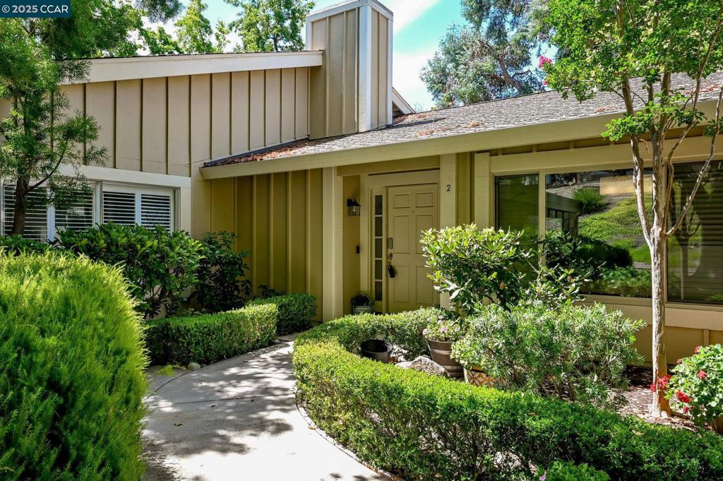 Experience the perfect blend of comfort and convenience in this beautifully updated single-level, no steps to entry condominium, ideally located in one of Rossmoor’s most desirable neighborhoods. Step inside to an open floor plan with soaring vaulted ceilings and a cozy wood-burning fireplace—perfect for quiet evenings or entertaining guests. The fully remodeled kitchen showcases Silestone quartz countertops, new cabinetry, and modern appliances, and opens to a private, tiled patio surrounded by lush greenery for a serene outdoor retreat. A separate formal dining room adds elegance for special gatherings. Two spacious bedrooms include a primary suite with an updated ensuite bath, while the additional hall bath has been completely remodeled for a fresh, modern feel. Added conveniences include an in-unit laundry room with utility sink and built-in shelving, fresh interior paint, recessed lighting throughout, and elegant tile flooring with radiant heat for year-round comfort. This rare home also offers both an attached garage and a carport—hard to find in Rossmoor! Designed for easy, lock-and-leave living, it combines low-maintenance elegance with a peaceful setting. Enjoy being just minutes from walking paths, dining, and all the wonderful community amenities Rossmoor is known for.