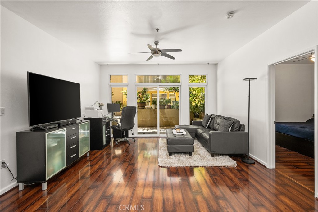 Welcome to this beautifully maintained ground, end-unit condo in the highly sought-after Burbank Collection, offering the perfect blend of privacy, comfort, and convenience. This elegant home boasts the largest private patio in the entire community, creating an exclusive outdoor retreat ideal for relaxation or entertaining. Inside, you’ll find an open layout with two spacious bedrooms, two bathrooms, granite countertops, in-unit laundry, abundant storage, and the added privacy of being one of the rare units that shares only a single wall. The primary suite features dual sinks, a soaking tub, and a walk-in shower. Modern upgrades include a NuvoH2O whole-condo filtration system with additional filters for the kitchen sink, fridge, and dishwasher, plus central AC/heat and CAT 5 wiring throughout for fast internet for those work-from-home days. Two parking spaces with extra storage add everyday convenience as well as guest passes. Community amenities include a sparkling pool, fitness center, putting green, BBQ area with fire pit, and resident lounge with billiards. Just outside your door, enjoy Downtown Burbank’s theaters, famous shops, dining, and festivals, with Metrolink, the 5 Freeway, and major studios minutes away. This is a rare opportunity to own a private retreat in the heart of Burbank!