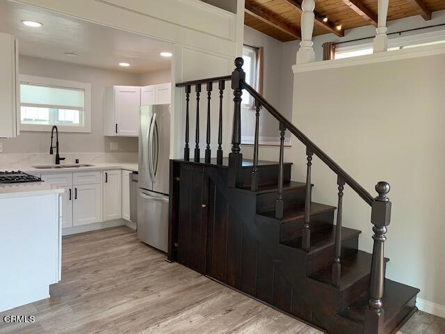 If you are looking for a comfortable and cozy beach house to rent, this newly renovated 2 bed+2 bath house is the perfect place for you. With all new paint and appliances, you can be assured that you will have a fresh and clean living space.The kitchen is the heart of any home, and this beach house has a bright white kitchen that will surely inspire your inner gourmet chef. With plenty of cabinet space, you will have ample room to store all your cooking essentials. The living area is naturally lit, providing a warm and inviting atmosphere. The balcony is perfect for enjoying your morning coffee or watching the sunset with a glass of wine.The bedrooms have built-in storage, so you don't have to worry about cluttering your living space with unnecessary furniture. There is enough space for all your clothes and personal belongings. The backyard is the perfect place to relax and unwind. With a cozy seating area, you can enjoy the cool ocean breeze.The additional studio office space is perfect for those who work from home. With plenty of natural light and a comfortable desk, you can be productive while enjoying the comfort of your new space. The washer and dryer are conveniently located in the single car garage, making laundry day a breeze.Overall, this beach house is the perfect place for those who want to enjoy the beach lifestyle while still having all the comforts of home. Don't miss out on this amazing opportunity to live in a newly renovated beach house!
