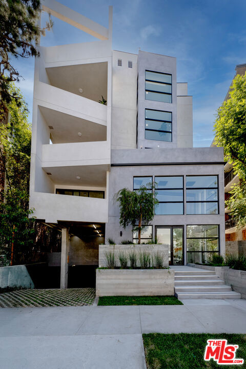 2025 Ultra-Modern Boutique Condominium in Prime Westwood. A brand-new 2025 architectural gem, this boutique building of only 15 residences is just minutes from UCLA and Westwood Village-perfect for students, faculty, or professionals seeking elegance, convenience, and walkability.This 4th-floor 1BR/1.5BA residence offers open-concept living with oversized black-framed windows, oak hardwood floors, custom built-ins, and refined luxury tile finishes. The designer kitchen showcases European cabinetry, quartz countertops, and premium Thermador appliances in select units, creating a stylish space for everyday living or entertaining. The bedroom includes an en-suite bath with a bathtub/shower combination.Residents enjoy secure parking, elevator, an elegant high-ceiling lobby, and exclusive top-floor penthouse units with private rooftops offering breathtaking city and mountain views. Set on a quiet, tree-lined street, the location offers effortless access to campus, cafes, fitness studios, shopping, and transit, with Beverly Hills, Century City, and Santa Monica just minutes away.Experience modern design, boutique exclusivity, and a Westwood lifestyle at its finest.