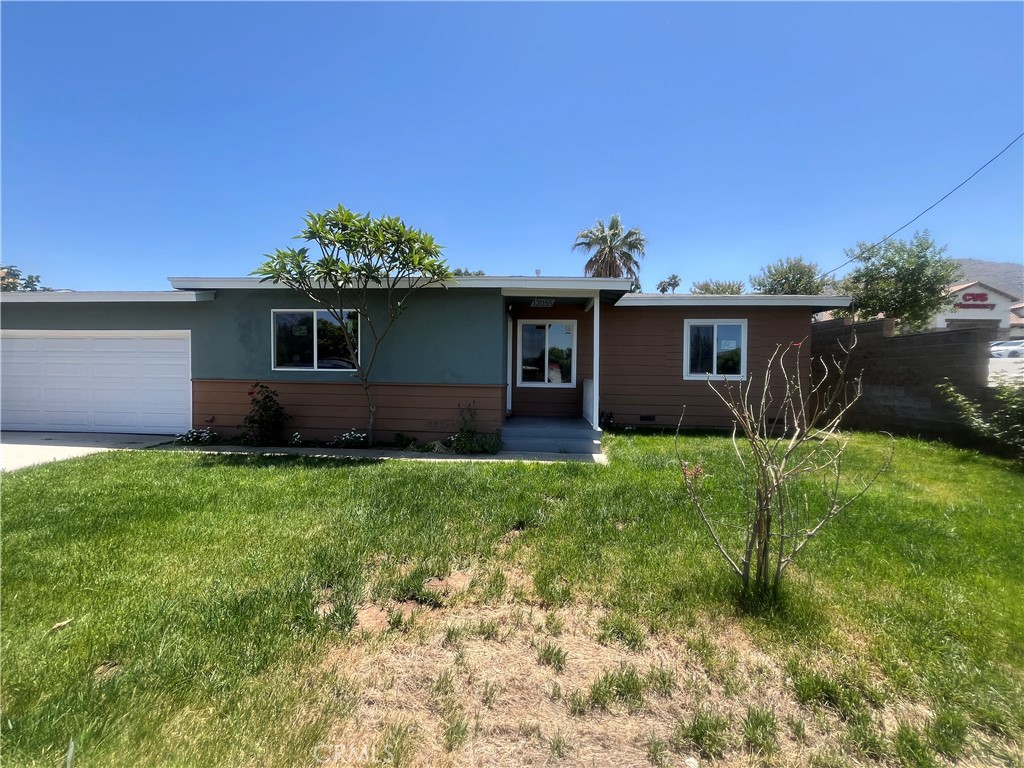 Fully Remodeled 3 BR 1.5 BA. HUGE LOT Grande Terrace House. Central air and heat installed, new laminate flooring throughout. New tile and fixtures in bathrooms and kitchen. Kitchen is brand new custom kitchen cabinets, new quarts stone counters, new garbage disposal, new pull out faucet, New custom bathroom with bathtub custom built shower with new tile walls with elegant tile design, new vanities, new toilets. All new plumbing fixtures. New light fixtures, New recessed lighting. New paint inside and out. Perfect FHA home must see
