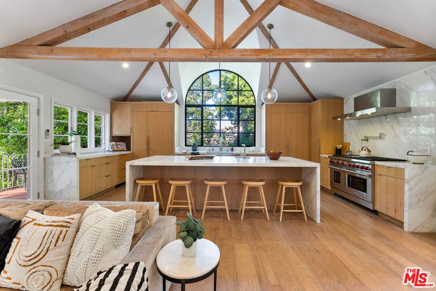 Just reduced by $1 million. Over 7,000 SF! Seller wants it sold now. Buy of the year! Don't miss out on this fabulous home in the prestigious Longridge Estates! it is going to go fast! Breathtaking and bold, this stunning 6-bedroom, 8-bath gated Spanish-style villa in the renowned Longridge Estates neighborhood is a must-see! Enter an elegant interior defined by crisp white tones, rich wood accents, chic lighting fixtures, and beautiful hardwood flooring. Vaulted ceilings soar over the numerous gathering areas, where dramatic fireplaces and wide windows create a lively atmosphere. A picturesque chandelier-lit dining room and an intimate family corner are ideal for entertaining, while expansive French doors beckon you outside to celebrate alfresco. A chef-inspired kitchen comes equipped with everything needed for your culinary adventures. Retire to one of your comfortable retreats, each with a stylish ensuite. Your generous primary suite steals the show with boutique-like closets, scenic balcony views, a striking fireplace, free-standing soaking tub, and a rainfall shower. Other highlights are a wine room and a state-of-the-art movie theatre. Unwind in your backyard, a lushly landscaped tropical oasis centered around a pristine pool and spa. Or spend the day at local hotspots like the Sportsmen's Lodge, the Galleria, and Universal CityWalk. Come for a tour while this gems still available!