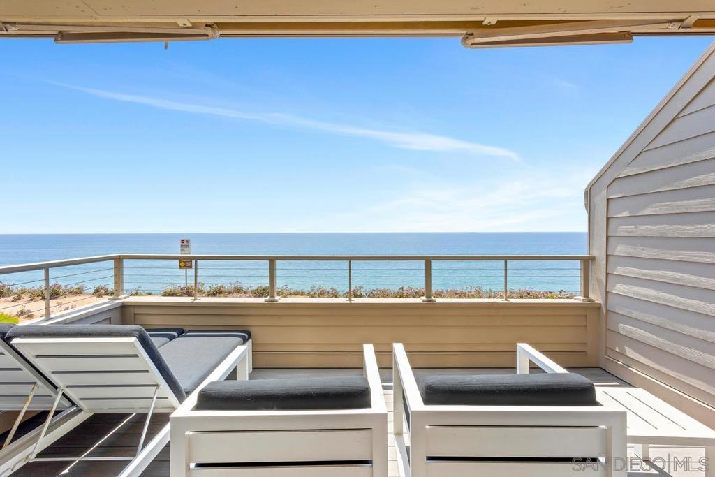 Wake up to the soothing sound of waves and panoramic views of the Pacific. This spectacular oceanfront townhome captures the coastline’s beauty, stretching all the way to La Jolla. Step into a sunlit sanctuary where expansive windows and sliding glass doors invite in ocean breezes and golden light. Tastefully furnished with modern elegance, each room offers a sense of calm, comfort, and effortless style. The open kitchen is a dream for any chef—featuring granite countertops, ample cabinetry, and all the essentials for hosting or unwinding by the sea. Retreat to the luxurious primary suite, where the spa-inspired bathroom boasts marble counters, a walk-in shower, and an atmosphere of serene indulgence. Perfectly positioned near Torrey Pines Golf Course, the Del Mar Fairgrounds and Racetrack, scenic coastal highways, and local hotspots—this is your gateway to outdoor adventure, cultural charm, and the relaxing rhythm of Del Mar living.