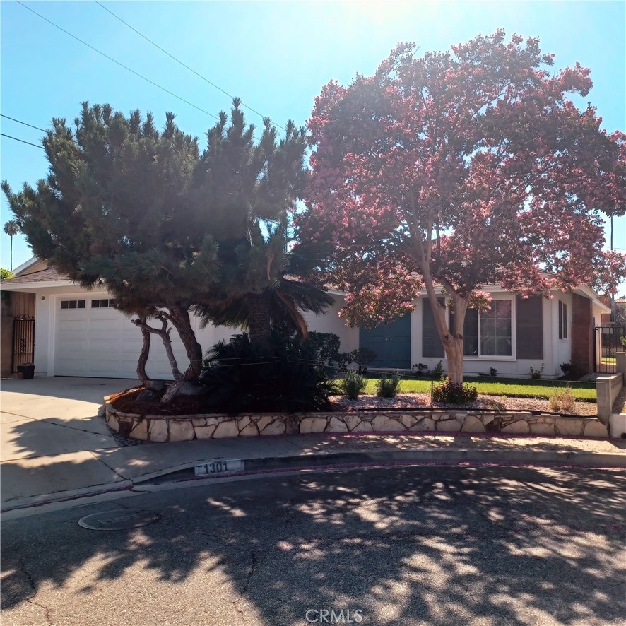 Tucked into a quiet cul-de-sac with long-standing neighbors and a welcoming sense of community, this beautifully updated 3-bedroom, 2-bath home offers 1,600 square feet of stylish comfort and modern convenience. Freshly painted inside and out, the home features new flooring throughout and energy-efficient Milgard windows and sliding glass doors that fill the space with natural light.
Enjoy year-round comfort with central air and heating, creating a cozy retreat in every season.
The kitchen is a true showpiece—renovated with custom soft-close cabinetry, a striking quartz waterfall countertop, and a premium Franke double basin sink. Champagne-toned hardware adds a touch of elegance, while recessed lighting and a ceiling fan create a warm, inviting atmosphere. All-new appliances include a stove/oven, microwave, dishwasher, and disposal—ready for everyday living or entertaining.
The bathrooms have been thoughtfully redesigned with custom cabinetry, quartz countertops, beveled mirrors, and a tiled shower featuring dual shower heads and sleek glass panels. New vanity lighting and ceiling ventilation complete the spa-like experience.
In the den, a stylish wet bar with custom cabinetry, quartz counters, and a new sink and faucet offers the perfect spot to unwind or host guests.
Step outside to enjoy newly landscaped grounds with fresh sod, vibrant plantings, decorative gravel, bark, and DG. A sun-shaded brick patio invites relaxation, while drip irrigation and an automatic sprinkler system make upkeep effortless. The upgraded, county-approved electrical panel and new garage door add peace of mind and curb appeal.