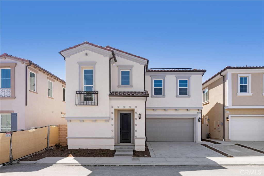 This brand new single-family residence is situated in the prestigious Terraces at Walnut, a guard-gated community offering both security and exclusivity. Designed with modern living in mind, the home features 4 bedrooms and 3.5 bathrooms, including a sought-after main-level en-suite bedroom, ideal for guests or multi-generational living. The entry greets you with soaring high ceilings, leading to a spacious open-concept floor plan that seamlessly connects the living, dining, and kitchen areas. The chef’s kitchen is appointed with stainless steel appliances and a generous pantry. Upstairs, a large loft offers flexible space for a family room, office, or play area. Perfectly positioned just across the street from the Marketplace shopping center and only minutes from the award-winning Walnut High School, this home blends comfort, style, and a prime location.