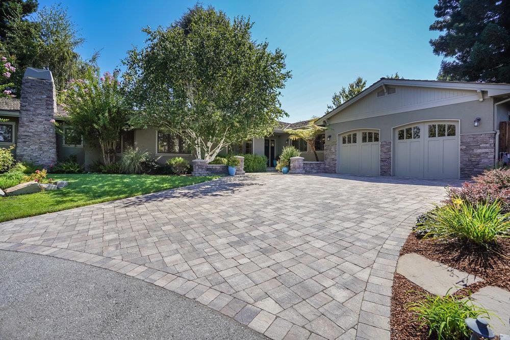 Located at the end of a highly desirable North Los Altos cul-de-sac, this 5 bedroom, 4.5 bath home was custom built by the current owners for their family. Built by Chase and Arnold builders, (architect was Jeanette Coran), this home was designed with attention to every detail inside and out. Exceptional finishes and amenities, high ceilings, oak hardwood refinished floors, crown moldings, recessed lighting, built-in speakers, home entertainment, Control 4 home automation, home theatre/gaming room, bonus hobby room and beautifully landscaped throughout with mature trees, two decorative fountains, gas firepit, Lynx gas stainless barbecue, outdoor built-in seating, amazing gardens all of which were professionally designed by landscape architect Kate Lomax. This home has a wonderful and open floor plan, plus it has close proximity to the Village of Los Altos, as well as walking distance to both Almond Elementary and Los Altos High School and close biking distance to Egan Junior High.