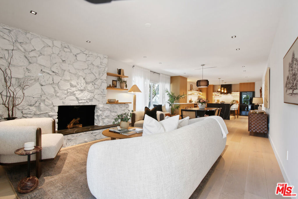 This fully remodeled home exudes modern luxury with a host of high-end upgrades designed to impress. Featuring new doors and hardware, new plumbing, new electrical, and owned solar panels. This property offers both style and sustainability. New air conditioning and heating system w Nest digital thermostat. Newer windows complement the exterior's stucco finish, enhancing the home's curb appeal. Inside, the open-concept layout invites natural light into the spacious living room, which is adorned with European white oak hardwood floors throughout. The dining room leads to a dream kitchen, complete with a large quartz island for ample seating and storage on both sides, built-in wine cooler, and built-in microwave. The kitchen features premium line Bespoke Appliances. The chef's kitchen includes custom European white oak cabinetry with under-cabinet channel lighting, a designated coffee/bar cabinet area, large sink with a touch-activated brushed gold faucet, large pantry, abundant soft-close drawers and cabinets with designer Emtek brushed gold pulls. The primary bedroom, accessible from the living room offers a walk-in closet and a luxurious ensuite with quartz countertops with custom double sinks, custom cabinetry, and custom glass enclosure. Additionally, two more bedrooms and a spa-inspired bathroom with custom cabinets, brushed gold faucets, heated mirror, and a beautifully designed shower offer an added sense of tranquility. Landscaping features a banana tree, lemon tree, guava tree, and backyard privacy. A large detached garage provides for potential ADU conversion with an adjacent parking spot. The front driveway has been updated with a concrete/DG pathway with beautiful landscaping including mango and banana trees. Short distance to South LA Cafe, Highly Likely, Harold & Belle's, Cafe5, Tartine, Fleurs et Sel, Vicky's All Day, Delicious Pizza, Alta Adams, Antiqua, and Mizlala. Close to the fwy, Expo line, Metro, Culver City, and DTLA. Located in Jefferson Park HPOZ. This home has the finest attention to detail and is a must-see!