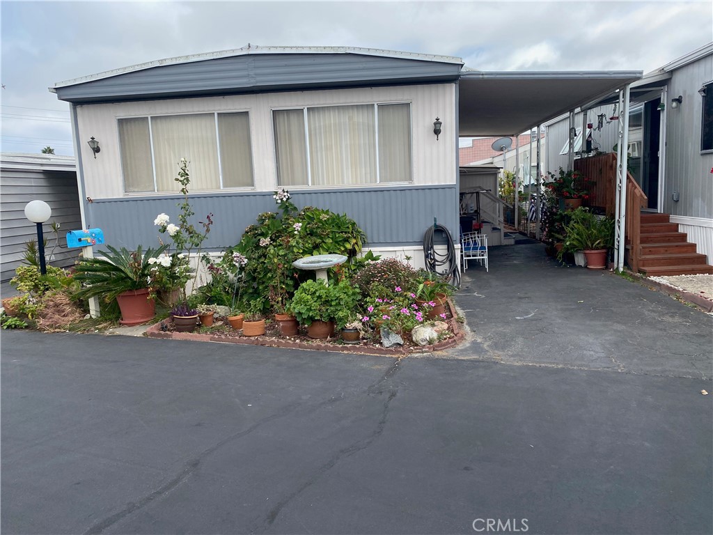 This 2bed 2bath double wide home has all new plumbing. It features in home washer/dryer, new Dish washer. The bedrooms feature large walk-in closets. Primary bedroom has private bath with shower. Park is located just 3 miles from the beach, and near by to Del Amo Mall. Nearby parks include El Nido and Columbia. With just 99 units the park has a cozy neighborhood feel. There is a newly remodeled Community Club house with a large well maintained pool and gym.