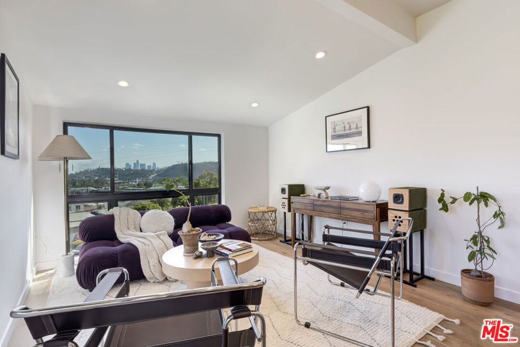 Embrace the perfect fusion of outdoor and indoor California living. Get the rare opportunity to live in one unit and rent the other in this serene sanctuary perched high above the street with views of downtown! This stylish and thoroughly renovated duplex is light-filled and sophisticatedly remodeled from top to bottom!! Newer double-pane windows, wood floors & doors, central ductless HVAC systems, updated electrical panels and wiring, copper plumbing, ABS drain lines, tankless water heaters, and the home was retrofitted, bolted and sheer walls were added in basement area. This space has all the modern updates! Each unit features stunning views through its oversized Industrial style windows, beautiful white oak wood floors, premium stone countertops, and recessed lighting, setting the stage for a refined living experience. The galley kitchens are a chef's delight, equipped with a farm-style sink, custom white oak cabinets on top, a stainless-steel appliances, a double-door refrigerator, a dishwasher, and all the modern amenities to inspire culinary creativity. The top-floor unit has two bedrooms and two bathrooms, open concept living room and dining room with mesmerizing views! Step outside to through the office area to discover the backyard oasis; perfect for entertaining guestsa private yard ideal for alfresco dining and gatherings. Additional conveniences include a laundry area with a washer and dryer, and storage space. The first-floor unit is a perfectly sized one-bedroom, one-bath unit with equally impressive views, wood floors, an office area, a galley kitchen, its own laundry space, and a large, stunning bathroom with a rain shower. The home features an oversized, usable basement perfect for storing your additional items, including bikes and weekend toys. There is one covered parking spot in front. This home is ideal for savvy investors or homeowners seeking extra income or a home office. It is conveniently located near freeways, Mt. Washington Gold Line, the Self Realization Center, as well as cafes and businesses in Glassell Park and Highland Park, such as Habitat, Target, Glassell Park Pool Recreation Center, LA Bike Path, Elyria Canyon hiking trails, Lemon Poppy Kitchen, Dunsmoor, Bub and Grandma's, and much more! This home is more than just a place to live; it's a lifestyle to be cherished.