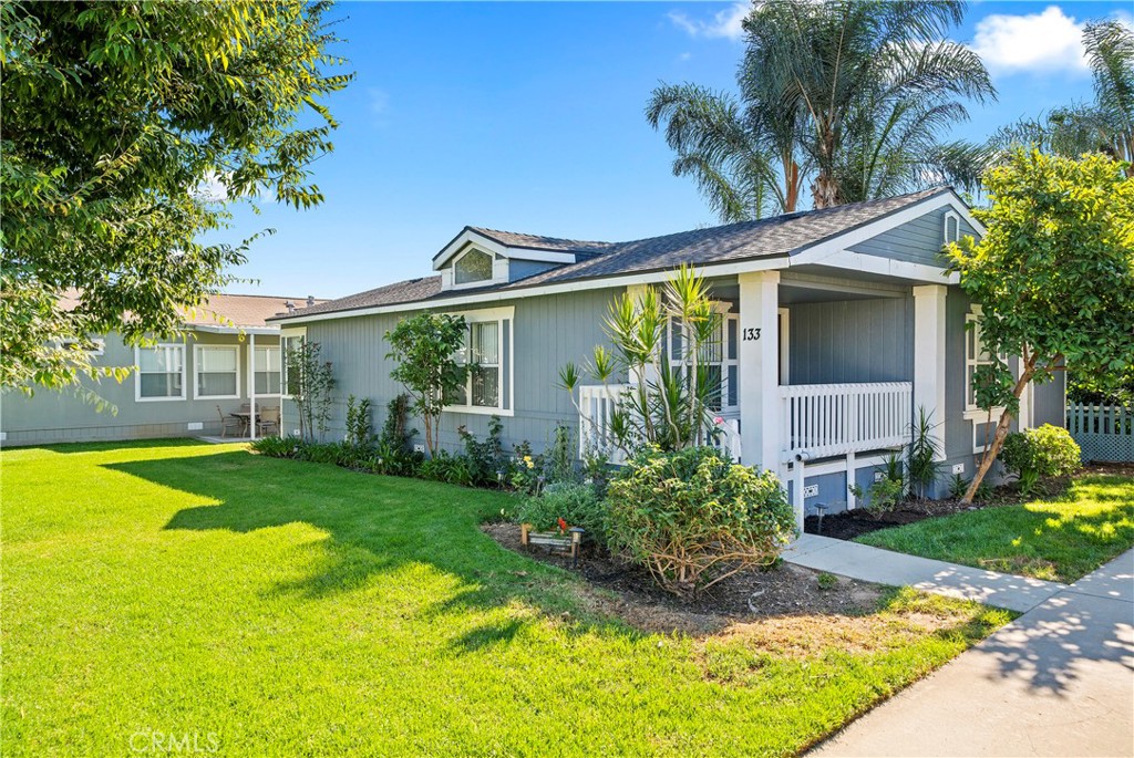 Manufactured Home on leased land | Two (2) Bedroom | Two (2) Baths | There are greenbelts throughout the community and a big, beautifully remodeled clubhouse with a gym, pool, spa, children's play area, a sports court, and more! There's also RV storage available! Shopping, services, and entertainment are just steps away from your home, as is Yorba Regional Park. There's so much to do just minutes from home, you may never want to leave! This 2-bedroom, 2-bath home overlooks a lush greenbelt that the association maintains. Upon entering the light-filled home, there's a big, comfortable GREAT room with a cathedral ceiling and a dining room with ample space for a large dining set just beyond. The beautiful kitchen is open to the other rooms and has been nicely updated. Right next to the kitchen, you have your own laundry room, as well as access to the rear yard and storage shed. Just past the family room is the large master bedroom and bathroom.