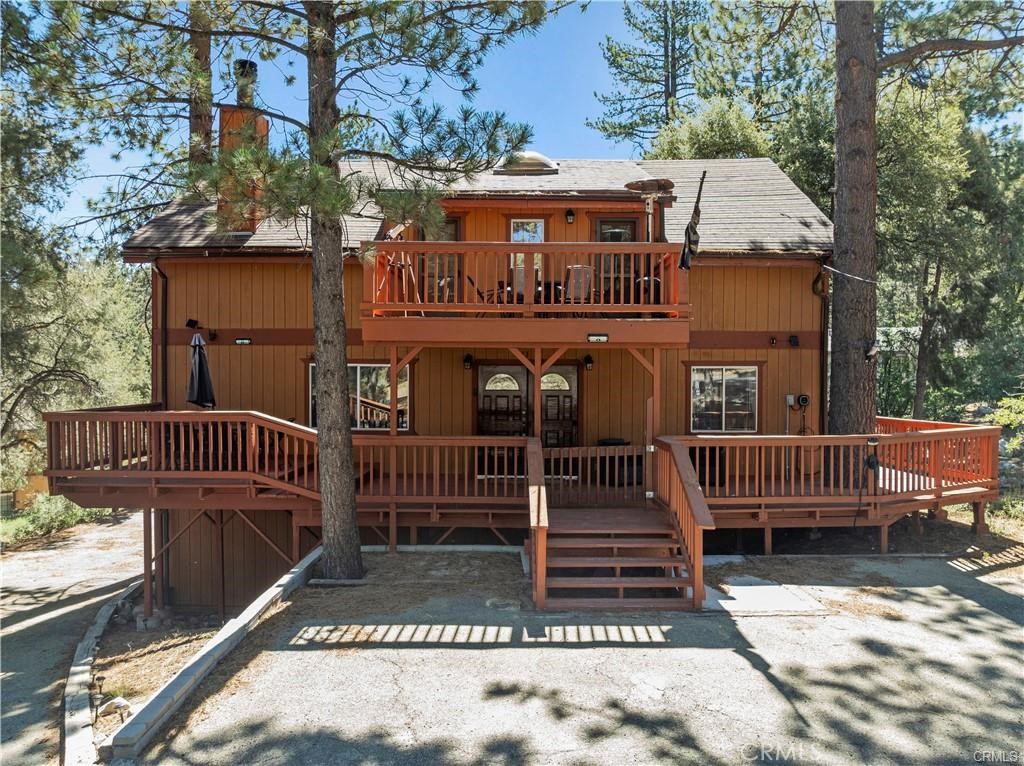 Exceptional mountain home in Pine Mountain Club that offers everything you could ever want and more! Conveniently located near the village center and enveloped by the beauty of nature with towering pine trees, this magnificent home is a dream come true. As you step inside, you will be greeted by the warm embrace of wood flooring and a light, airy open floor plan that provides ample space for all your needs. Featuring spacious bedrooms, including one on the main level, this home boasts a large 10,700 square ft lot where you can relish in peaceful meadow and forest views, surrounded by majestic pines and beautifully landscaped yards. Whether you are looking to host grand gatherings or simply unwind in a serene setting, the expansive deck is the perfect place to create lasting memories. Additionally, the home offers practical amenities such as a storage area with a concrete floor, an RV driveway, and an oversized two-car detached garage with custom cabinets and workspace which is currently used as a game room. This outstanding property is a rare find in Pine Mountain Club and presents itself as an ideal primary residence, a vacation sanctuary, or a lucrative investment opportunity.