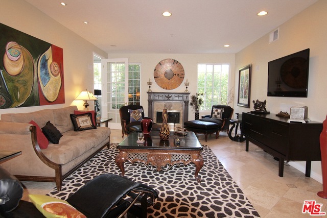 Your private entertaining oasis awaits! Sleek, designer-done condo in one of the most sought after buildings on Doheny - just one block south of the Sunset Strip. This gorgeous 2 BR/2.5 BA has been remodeled to the nines and features an open layout with bedrooms on either end of the unit. Majestic double-door entry leads to impressively large light-filled open living and dining room w built-ins and a centerpiece gas-burning fireplace. Eat-in kitchen w granite countertops and all-stainless steel appliances. Beautiful half-bath is just off living room. Large office/media/bonus space just off living room. Guest bedroom features ample closet space and modern full bath just across the hallway. Private master suite with walk-in closet and en-suite bathroom with large soaking tub and separate walk-in shower. Greenway views from all windows make this unit feel away from it all, yet in heart of it all. Building has gorgeous community spa/pool/sun deck. Two parking spaces w extra storage.