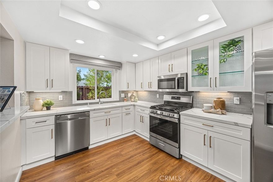 Welcome to this truly rare gem in tranquil north Monrovia:  Grab this once in a while opportunity to score a single story, end unit condo in a quiet residential neighborhood north of Foothill.  Just minutes from the pleasant, bustling vibe of Old Town Monrovia and all the quaint shops and restaurants.  Fussy buyers will appreciate this turnkey, completely remodeled home.  Tastefully modern update by the current owner who was going to make this their forever home.  This impeccable retreat is highlighted by complete remodel of both bathrooms and the kitchen featuring opulent looking quartz and new fixtures.  Your buyer will be swept away by the open, airy feel with vaulted ceilings, a gas fireplace, and new sliding door to your private getaway patio with new stone paving.  It wouldn’t be complete without new paint, new floors, matching stainless steel GE dishwasher, gas stove, microwave, and refrigerator.   Even the closets got a makeover from the container store in Pasadena.  The complex itself is well maintained, inviting, yet quiet and secluded.  Drive right in to your direct access, two car garage with new roll up door.  There is a laundry room in house.  

All data and detail provided in the MLS deemed reliable but not guaranteed by the listing agent.  Buyers to verify all information.