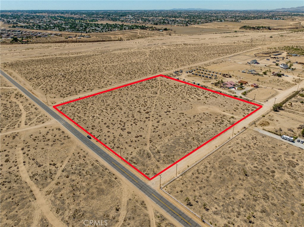 ** LOCATION - LOCATION - LOCATION ** GORGEOUS PANORAMIC VIEWS ** Come Build Your Very Own Custom Ranch Home. This leveled, spacious 10 acre lot is located on a paved road. Located in a desirable area of Apple Valley, this lot is within county limits. Zoned agriculture, you can build your custom home, a large warehouse/garage, create a ranch to raise your own animals, board horses, and so much more. Electric is readily accessible from multiple locations. Drill your own well to access the freshest water. Have the convenience of private, rural living while still living near shopping centers and restaurants. Easy for commuters needing to get to the freeway on Ranchero Rd. New gas station is being built on the corner of Deep Creek and Rock Springs Rd. Seller has already drawn plans for a 2,250 sq ft home to be built on this lot that can be negotiated with the sell.
