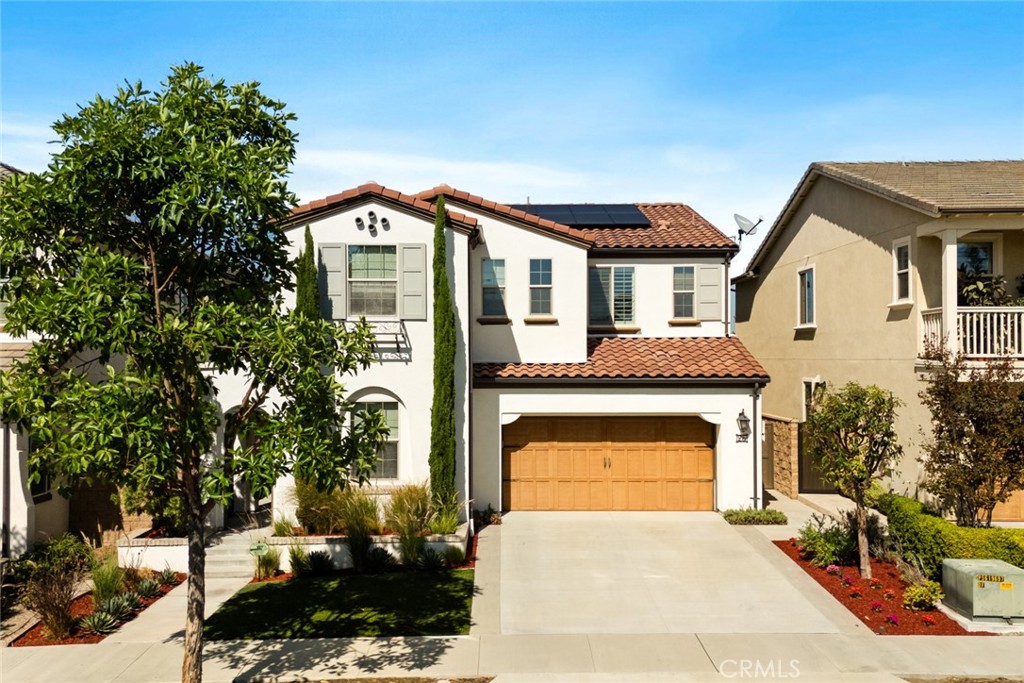 Step into sophistication with this highly upgraded, turnkey home situated on a larger, private premium lot within the coveted Greenwood Legacy community. PAID-OFF 6.72 kW Solar Electric System (save $100's every month). Designed for seamless living, the spacious open-concept first floor features an essential Downstairs Bedroom and Full Bath, perfect for guests or multi-generational living. The gourmet kitchen is an entertainer's dream, showcasing sleek quartz countertops with a designer backsplash, premium cabinetry with upgraded hardware, and a built-in KitchenAid refrigerator. The space is dramatically opened via large pocket doors that flow directly into the extended outdoor kitchen and living area. Enjoy unmatched privacy in the modern backyard, which does not face any other homes, and features a DCS barbecue with stainless steel hood, an expansive patio, built-in seating bench, and a contemporary fire pit. The home boasts superior designer finishes throughout, including a beautiful wood-railing staircase, upgraded tile, and large plank wood flooring across the great room, kitchen, upstairs bonus room, and primary bedroom. Additional highlights include a private courtyard entry, shutters and blinds, and extensive low-maintenance landscaping. Residents enjoy exclusive access to the Legacy Club amenities, featuring a resort-style pool, spa, BBQs, parks, and sports courts (including brand new PICKLEBALL COURTS!). This exceptional location offers swift access to The District, John Wayne Airport, and major freeways (5, 405, 55, 261), and is assigned to Heritage Elementary and Legacy Magnet Academy! No Pets