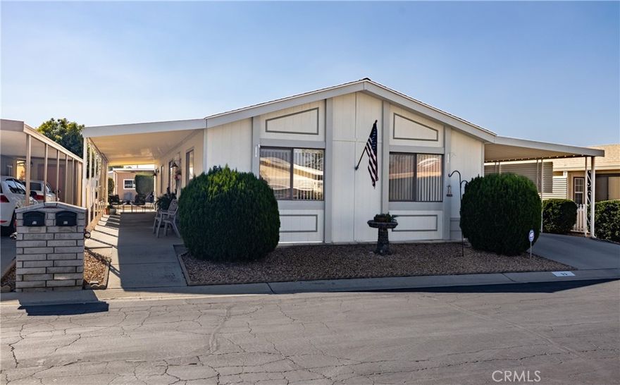 WELCOME HOME TO THE FOOTHILLS OF HEMET....THIS IS THE FINEST SENIOR COMMUNITY IN HEMET...55 +....Presenting a 2 bedroom 2 bathroom home with lots of upgrades...Recently remodeled with Luxury Vinyl Plank flooring...stunning !!! The kitchen is adorable and the cabinets have been painted a subtle green....very much on todays trend...Stainless Steel appliances and a bamboo shade for the window with the cutest pendant light..There is a spacious laundry room with lots of extra storage...The bedrooms are quite spacious and the primary has a walk in closet to die for ...This home also features a bonus room off the kitchen which is presently being used as a dining area but would also serve as a great office space...There is also new security screen doors..new overhead lights in the kitchen...modern new lights in the primary bath...new ceiling fans throughout...popcorn removed in guest bedroom and new toilets...new locks on all the doors with one key for all...the front and back yards are maintenance free and the patio has privacy shades and is a great spot for entertaining as well...the park itself is gated 24/7 for your peace of mind and the park is just fabulous with every kind of activity imaginable...do not miss this one ...this is priced to sell right now !!!