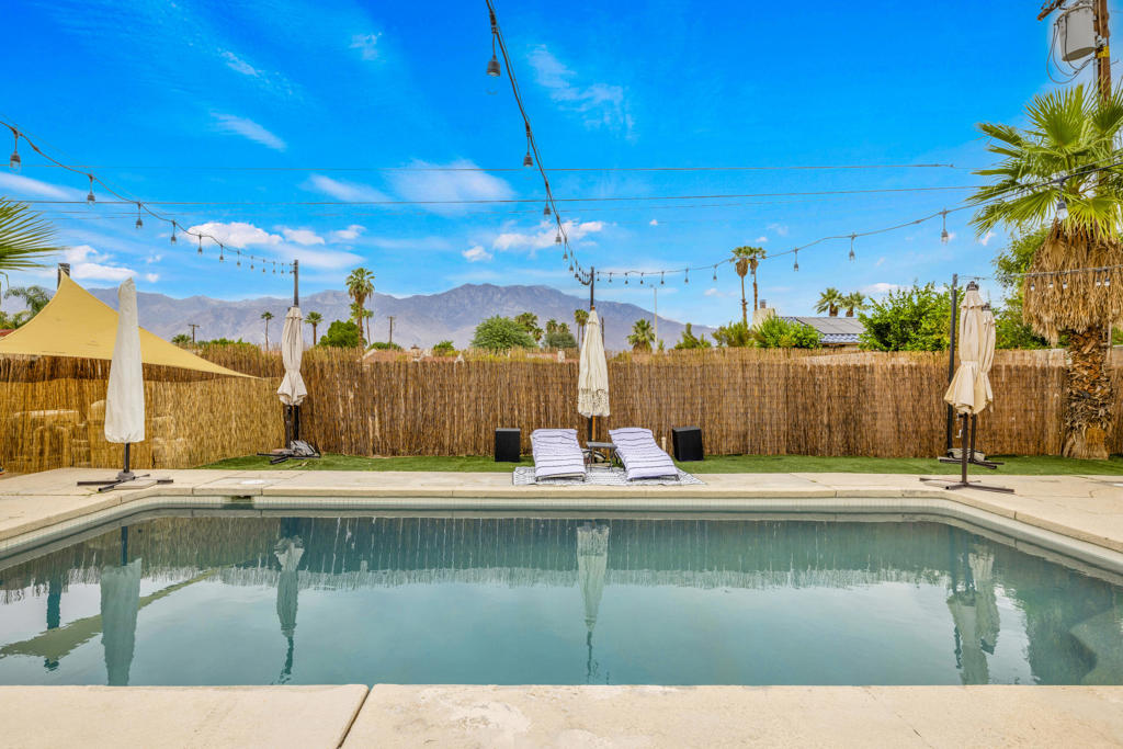 5BD/3BA with Private Casita + Resort Style Pool! Stunning home with attached casita featuring full kitchen, bath & private entrance that is ideal for multi-gen living or rental. Updated saltwater Pebble Tec pool/spa with new equipment, mountain views & large yard w/ extended covered patio perfect for entertaining. Designer-upgraded kitchen & baths, open floor plan, double doors in the living room and primary suite open to the backyard, creating seamless indoor-outdoor living. Spacious front yard w/ parking for multiple vehicles + EV charging & backup batteries. Prime location near I-10, shopping & dining! This home is the perfect fit for large families, multi-generational living, or savvy investors looking for a versatile property with incredible features.